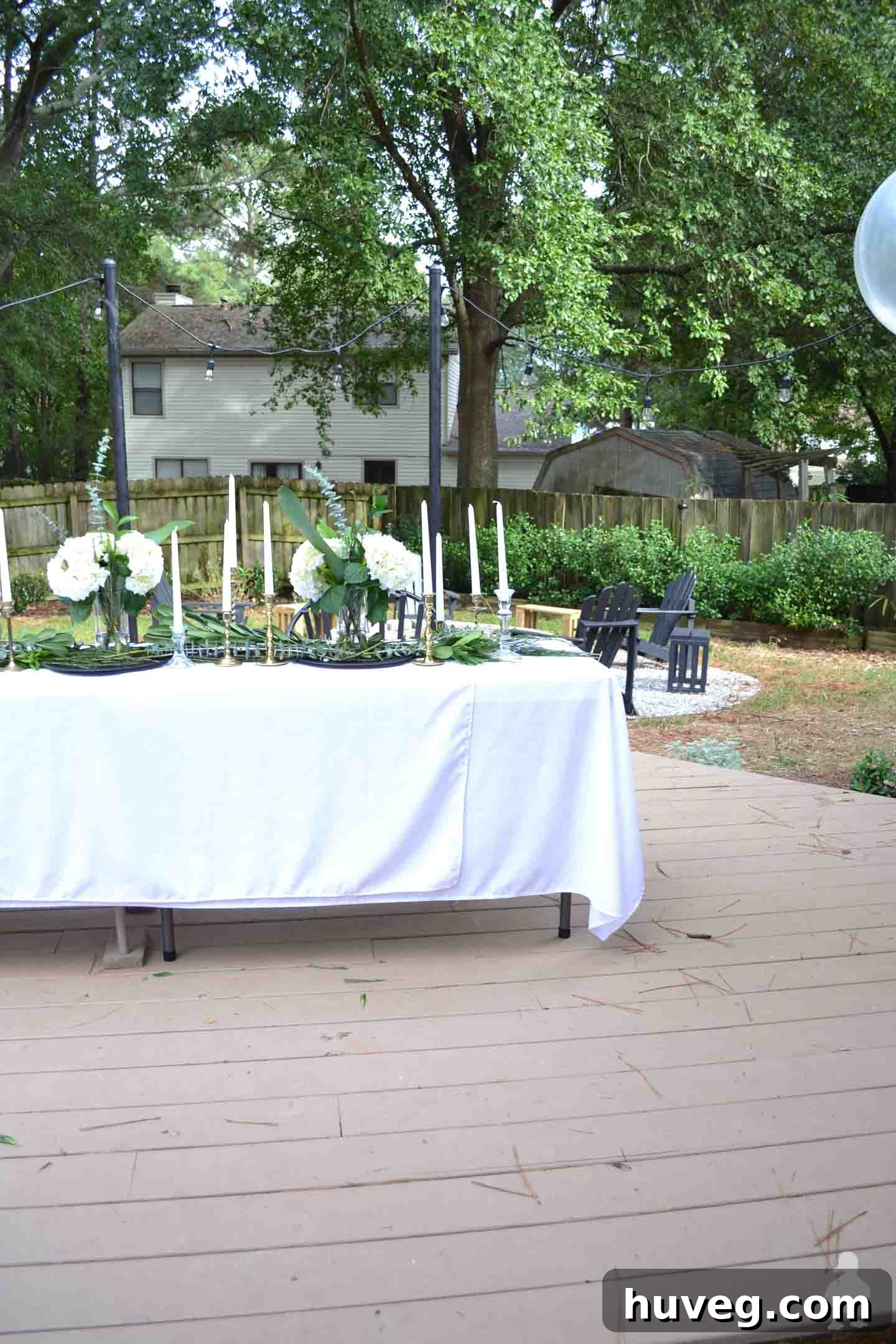 backyard dinner party with white tablecloths