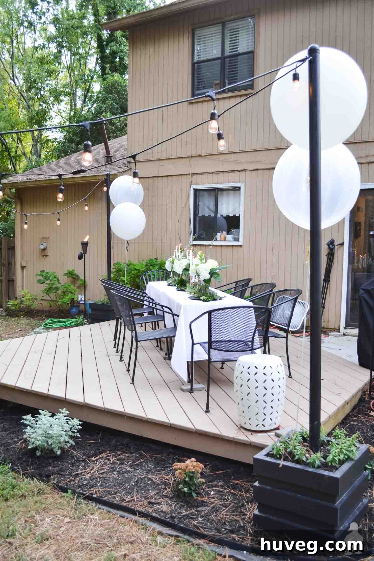 black light pole planters with outdoor hanging lights on floating deck
