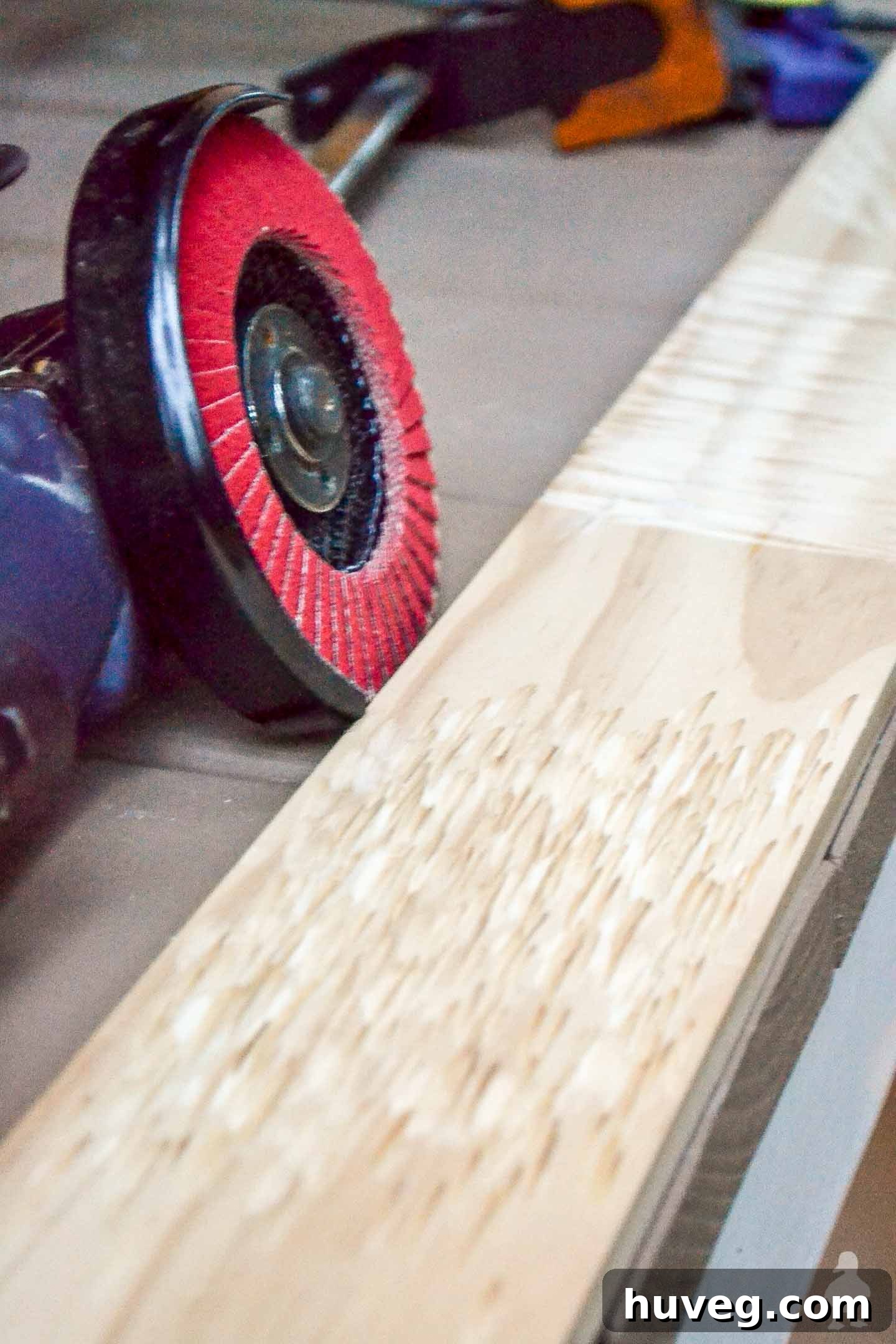 Detailed image of a texture pattern meticulously added to a piece of wood using an angle grinder, creating a unique worn and aged aesthetic for rustic wood ornaments.