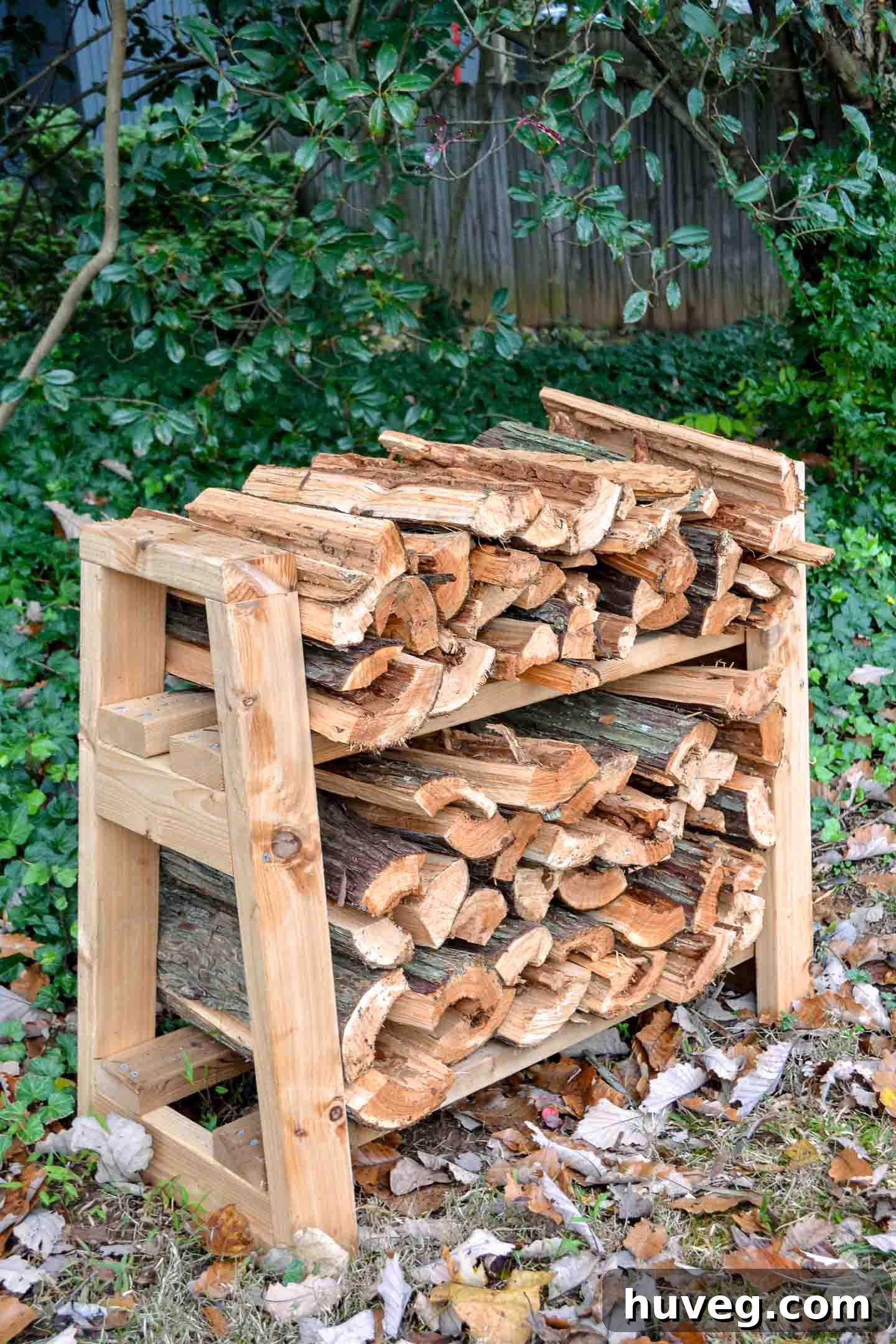 diy front porch firewood rack in ivy