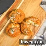 Golden brown baked turkey or chicken croquettes on a baking sheet
