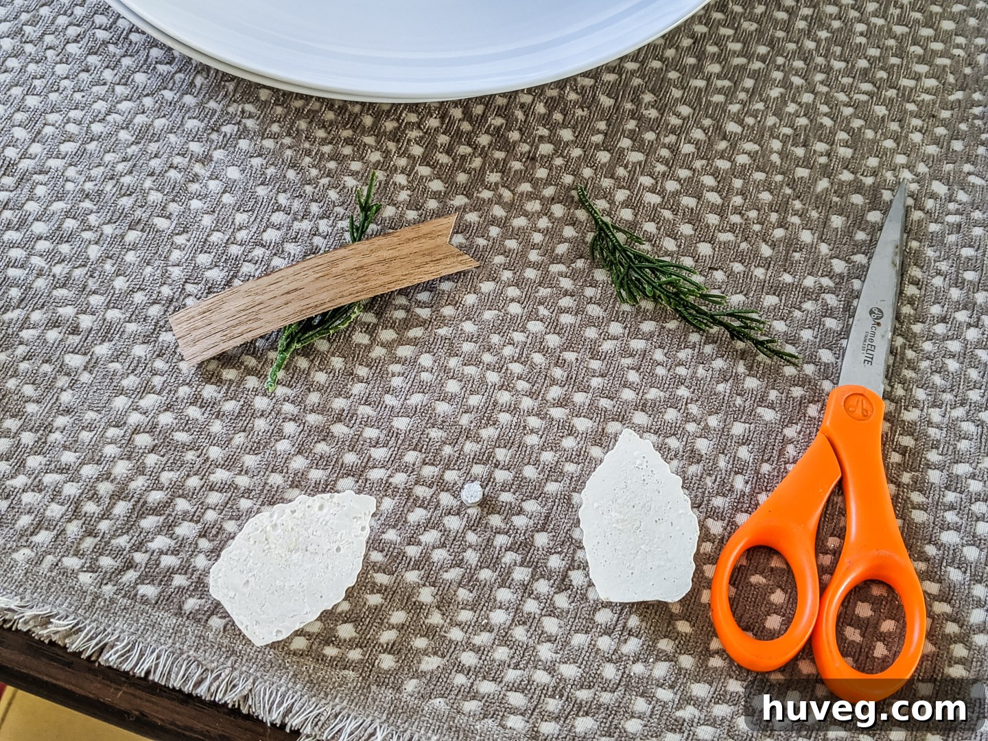 attaching magnets to the back of concrete pine cones with super glue