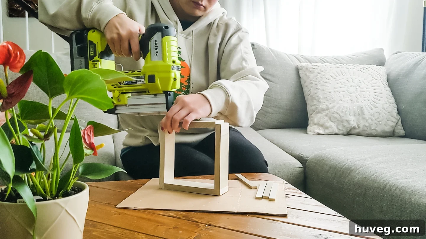 Assembling the wooden frame with glue and nails