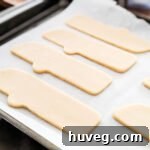 cut out each cookie and place on cookie sheet