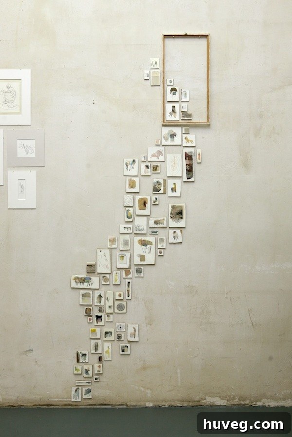 Inspiration for an entryway gallery wall with multiple canvases.