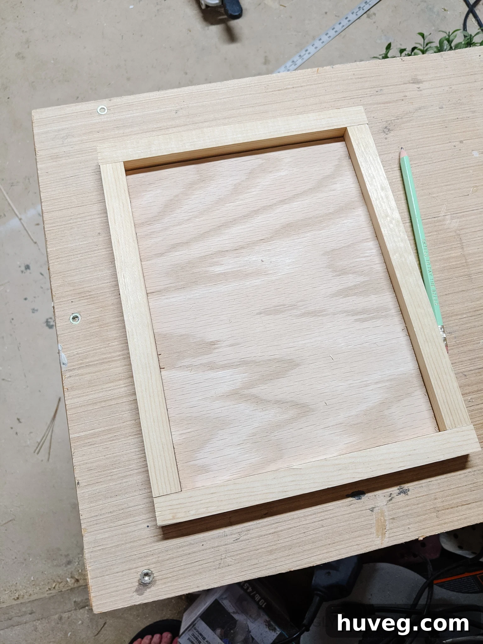 cut a frame to fit around the backer