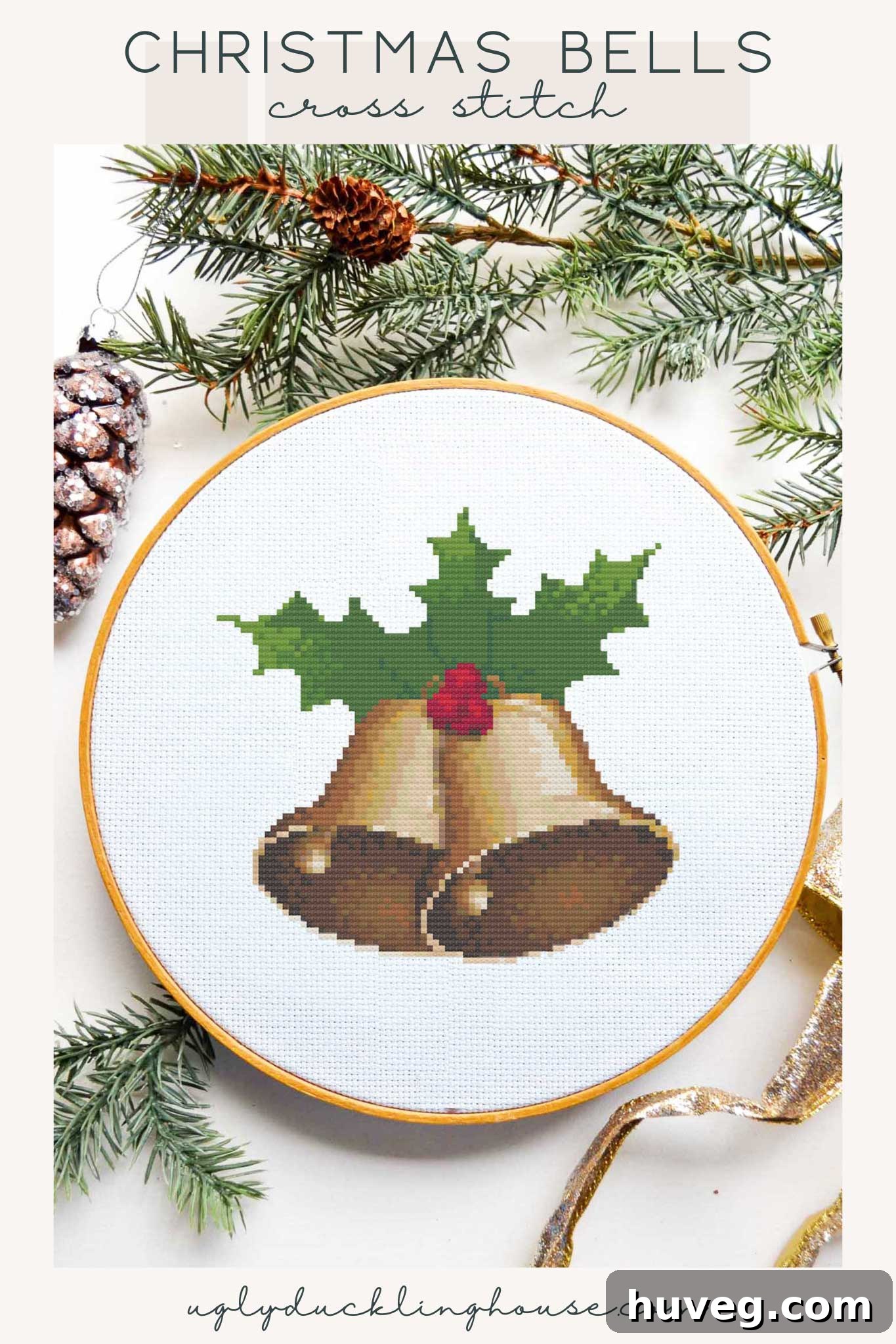 A beautifully stitched Christmas bells cross stitch pattern featuring red, green, and gold colors, perfect for holiday decoration.