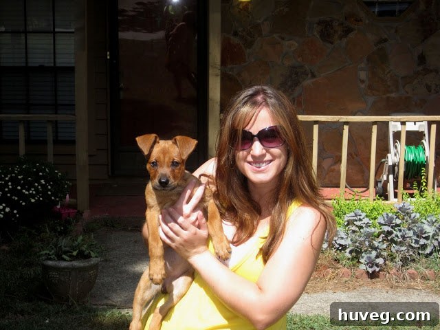 Sarah and Charlie in front of house closeup before house makeover