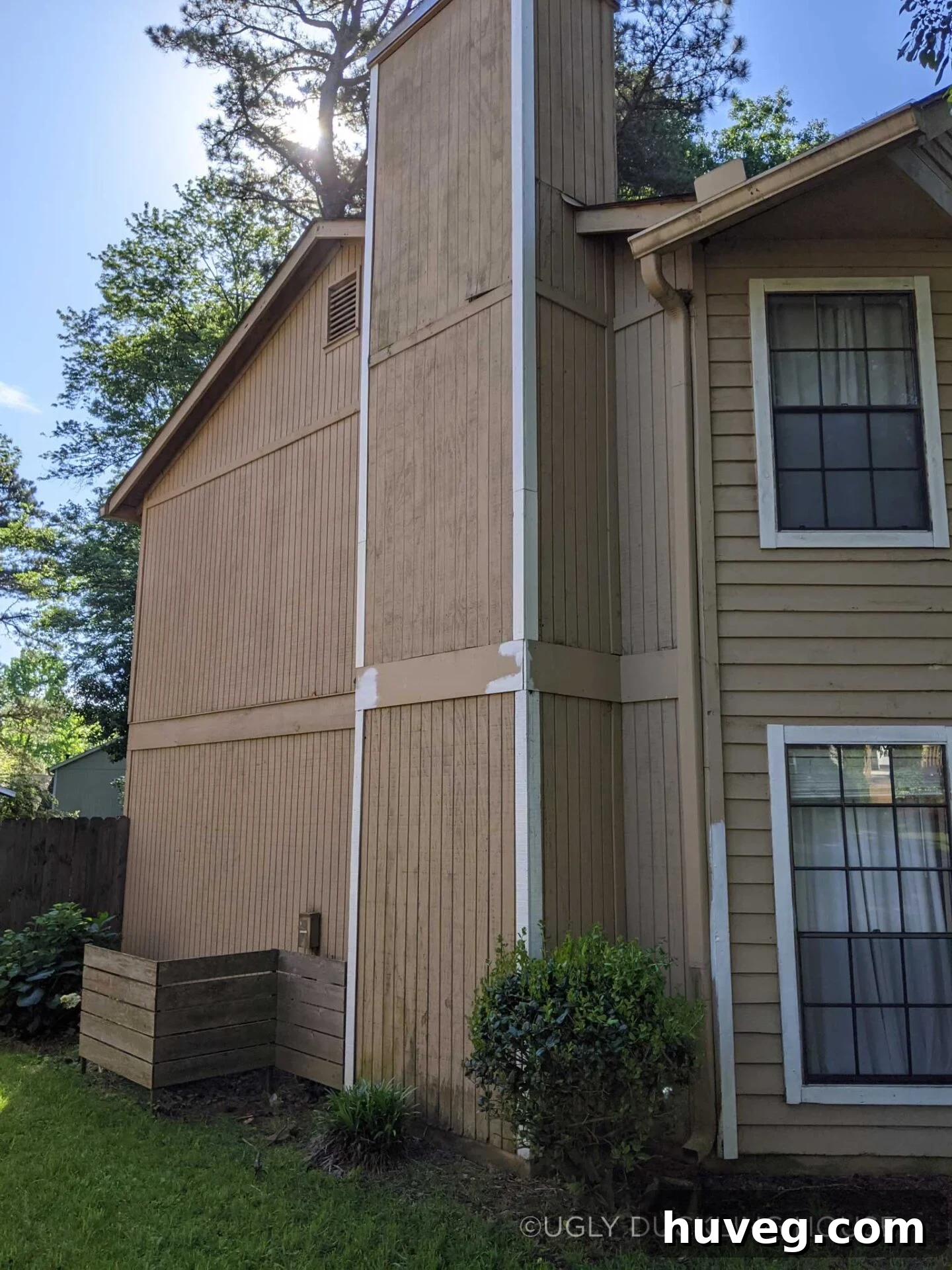 Unfinished trim work on the side of the house, illustrating the original neglected state