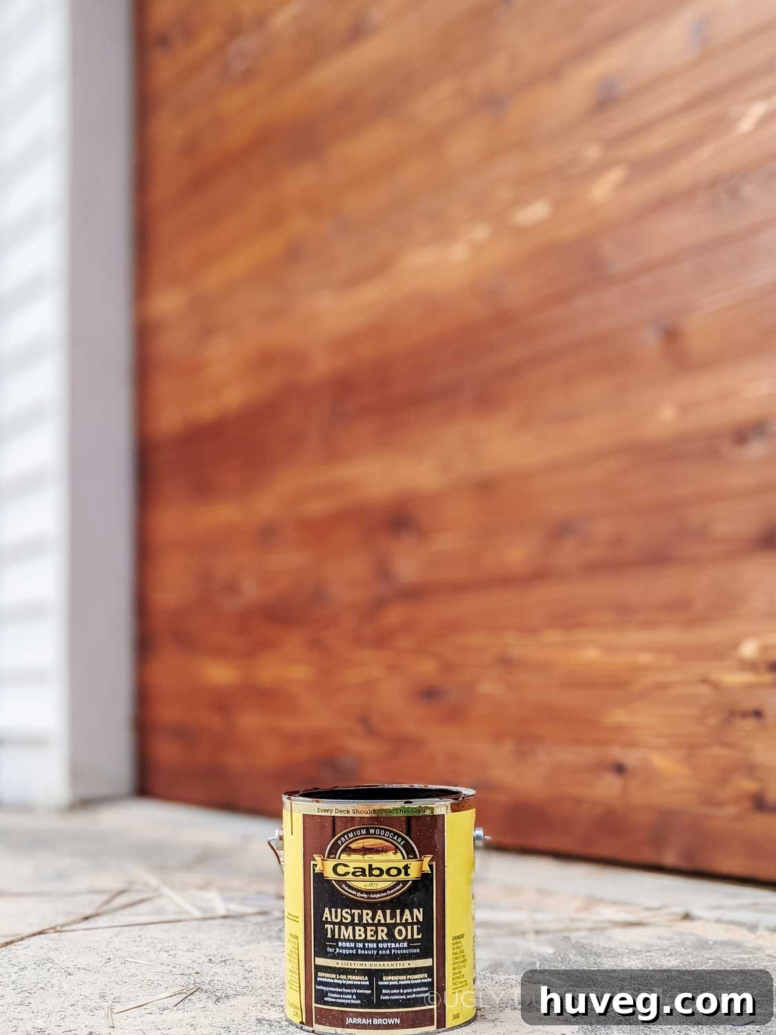 can of australian timber oil with garage door behind