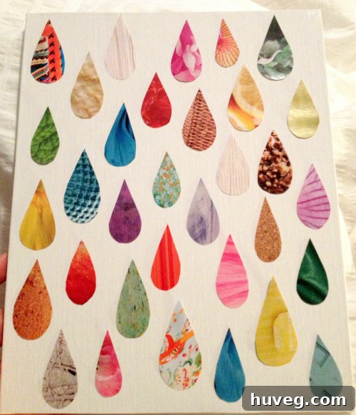 Arranging magazine cutout raindrops on canvas for aesthetic balance and dynamic composition