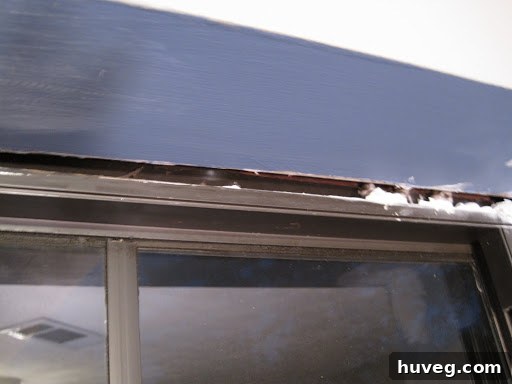 Large gap in an old window frame allowing drafts to enter a home
