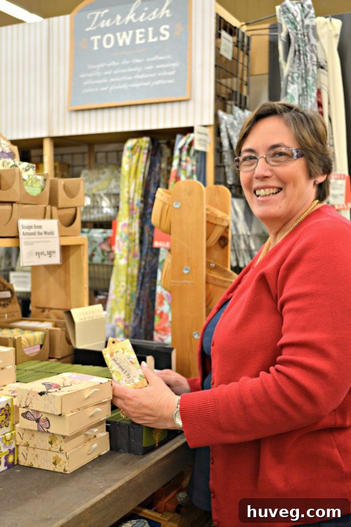 Mom smiling playfully after being caught smelling soaps on camera