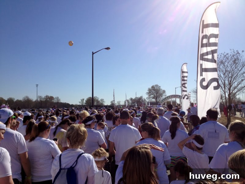 Runners gathering at the starting line of The Color Run 5k, brimming with excitement.