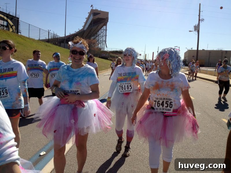 Inspirational senior women runners at The Color Run 5k, dressed in festive attire and radiating joy.