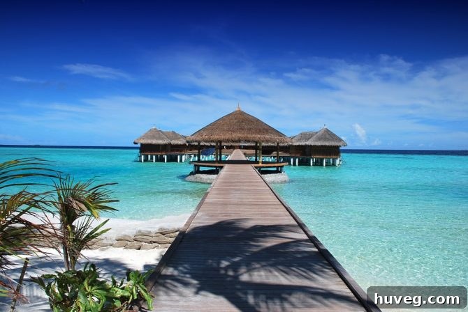 Stunning overwater bungalows in the Maldives, symbolizing an ultimate luxury beach escape and dream vacation.