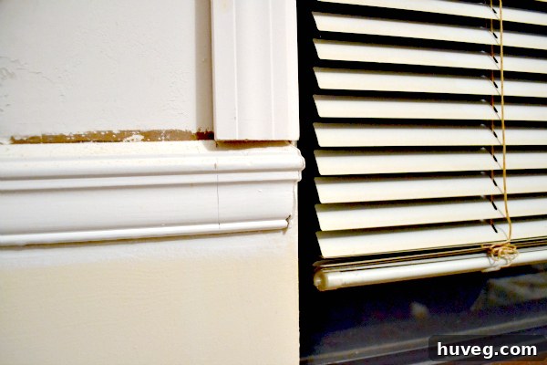 Marking the chair rail for removal to fit new window trim