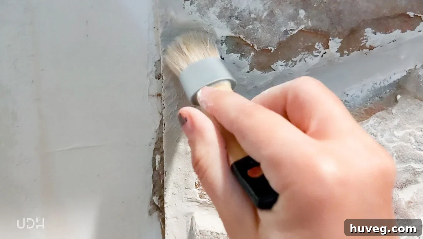 brushing-the-joint-compound-to-smooth-the-stonework