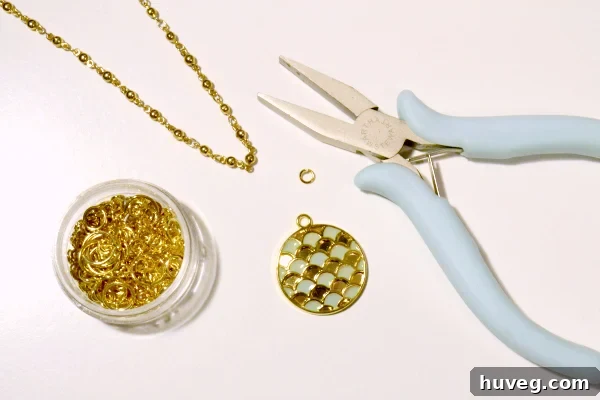 Assembling the enamel scallop necklace with jump rings and pliers