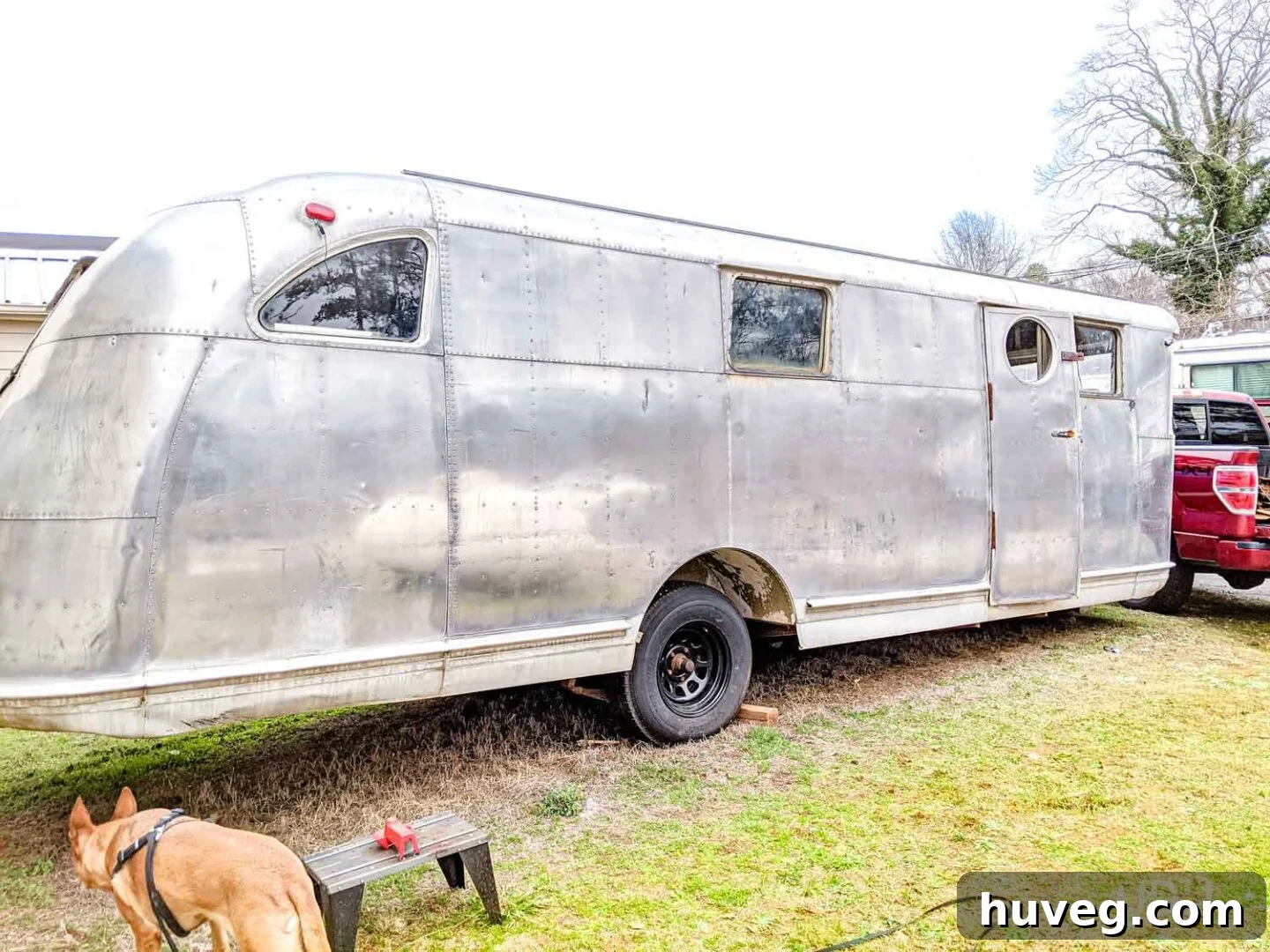 The vintage Spartan Manor camper's aluminum exterior shining brightly after the first polishing treatment, showcasing a remarkable improvement in clarity and reflectivity.