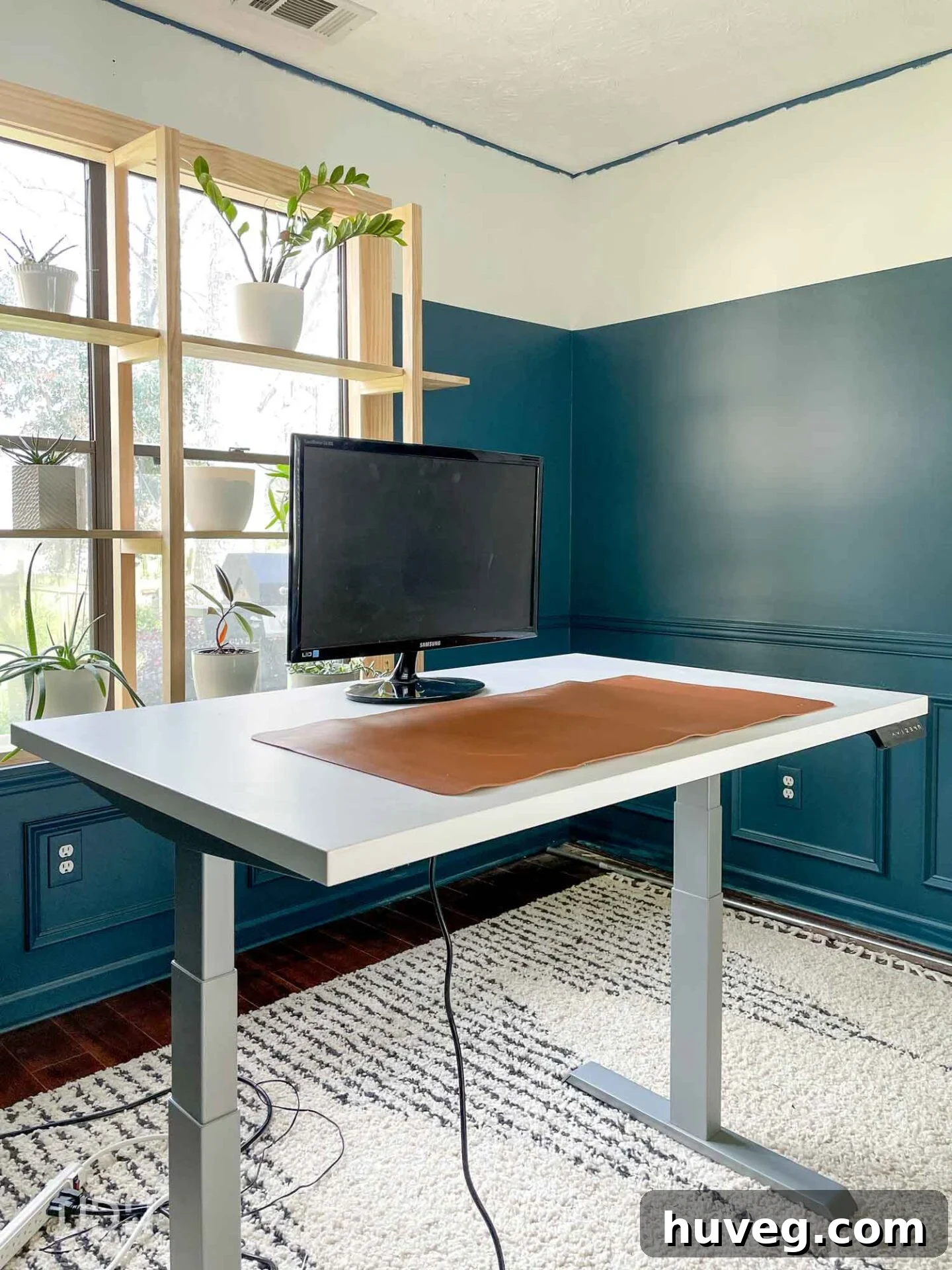 Sneak peek of the new office featuring dark teal color block walls in SW Newburg Green, hinting at future projects