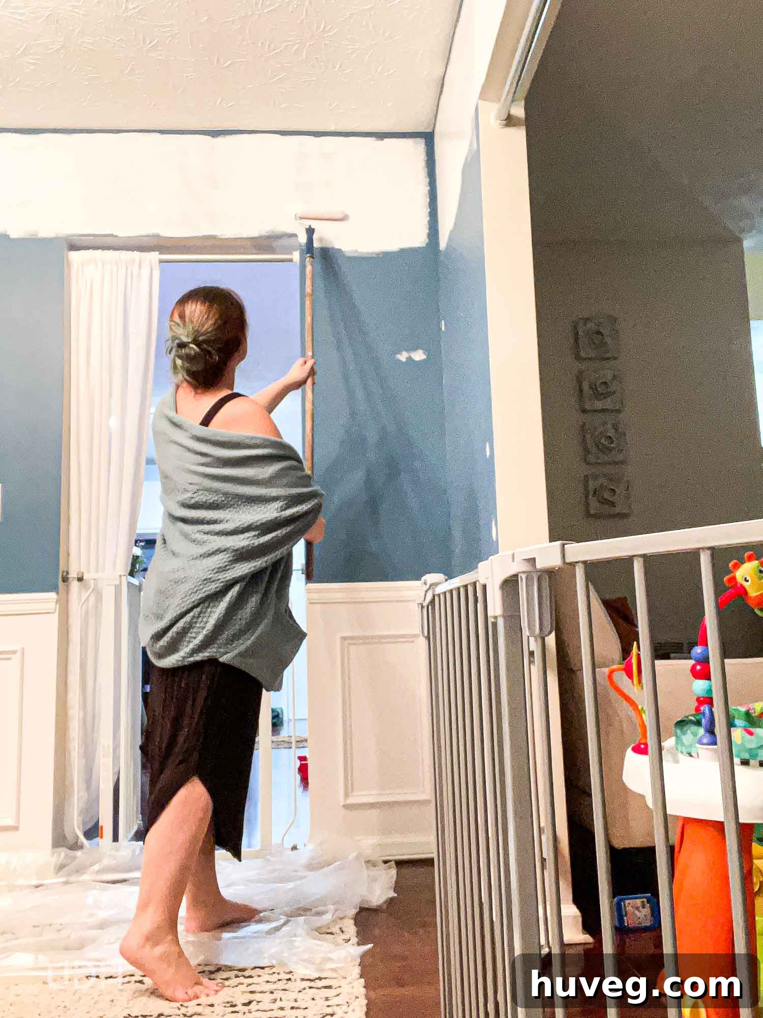 Painting the top quarter of walls white as the initial step for a color block design