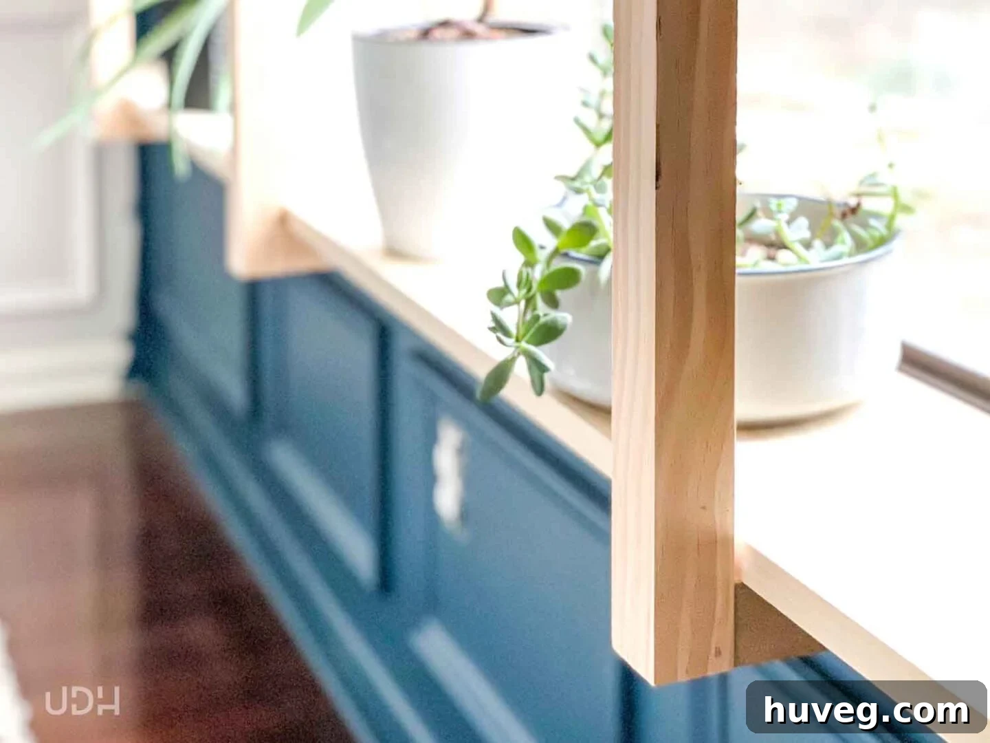 Painted office walls with matching teal trim, shoe molding, and outlet covers for a cohesive look