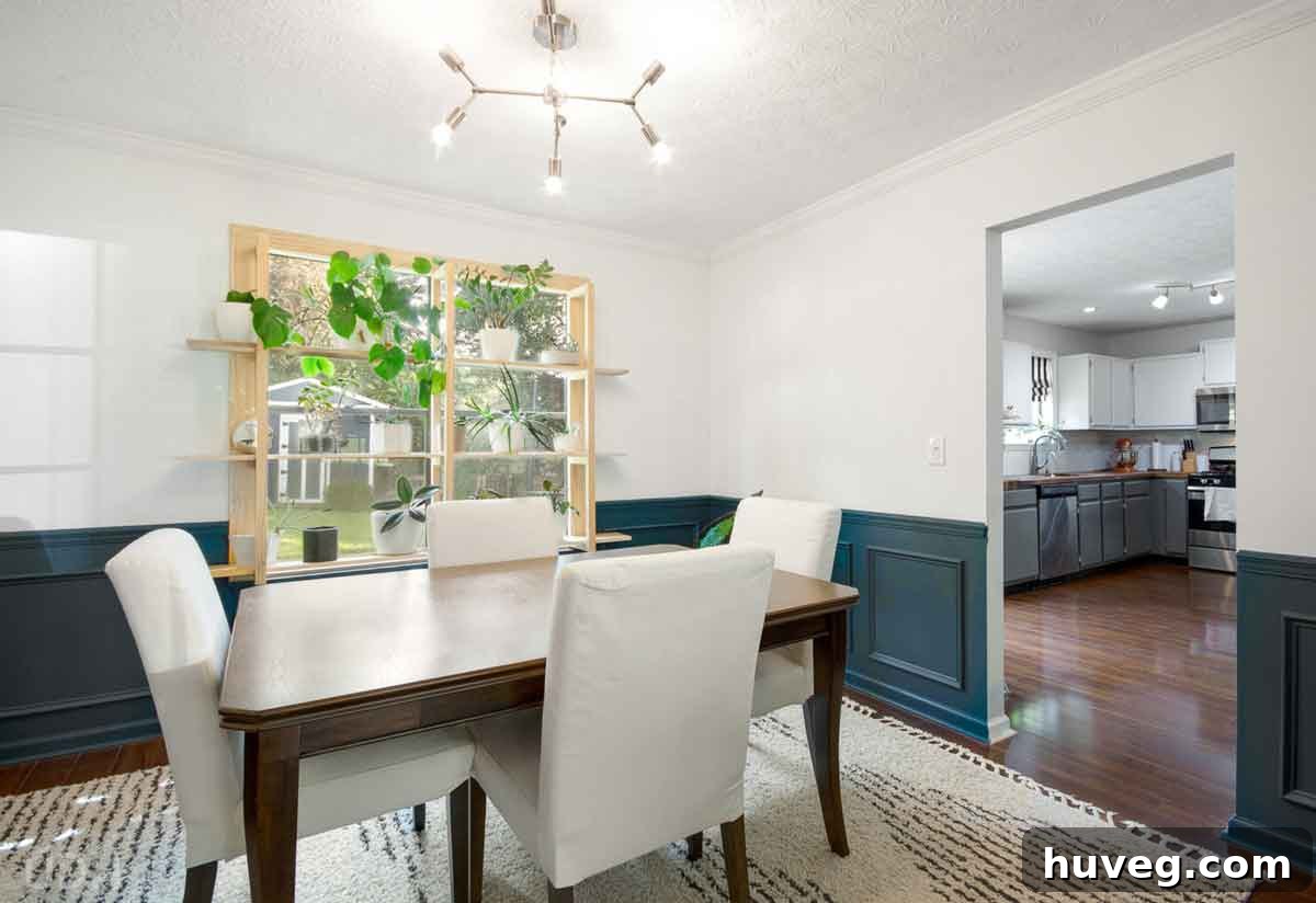 dining room after renovation with elegant teal picture frame moulding and new window plant shelves