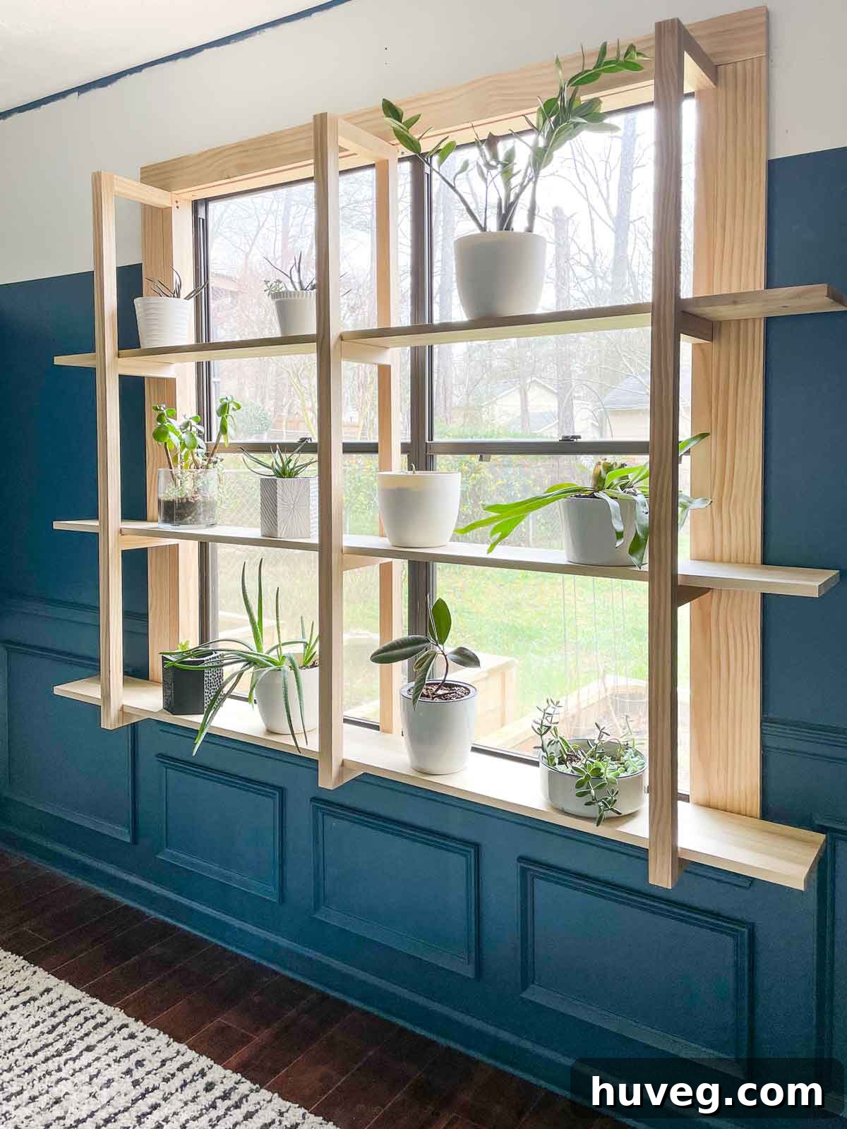 DIY window plant shelves full view with stylish dark teal half painted walls