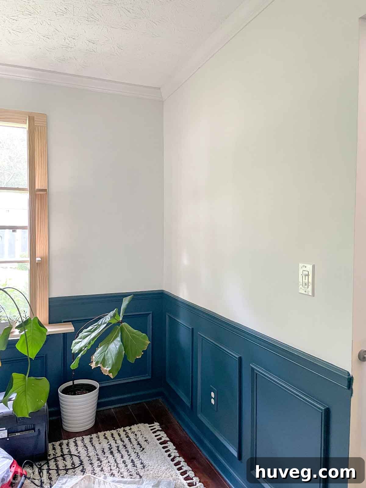 repainted dining room with Newburg Green picture frame moulding on the bottom