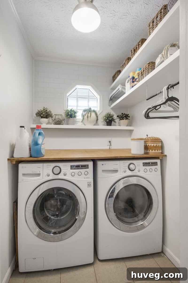 white laundry room with stained wood counter