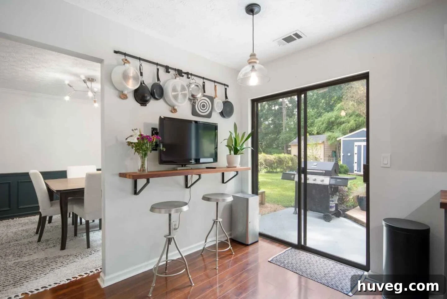 breakfast nook bar with butcher block counter and sliding glass door to patio