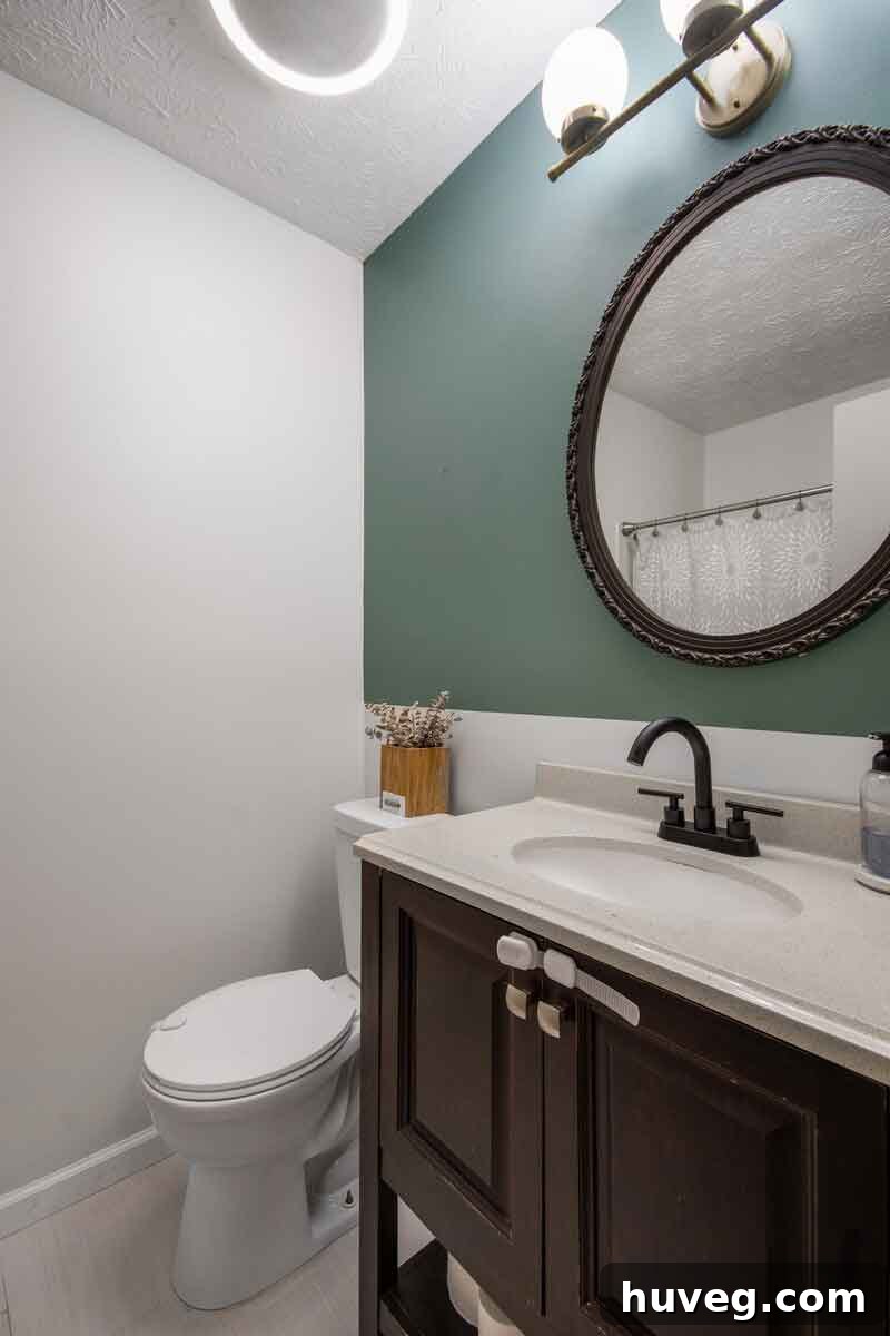 guest bath with color block green walls