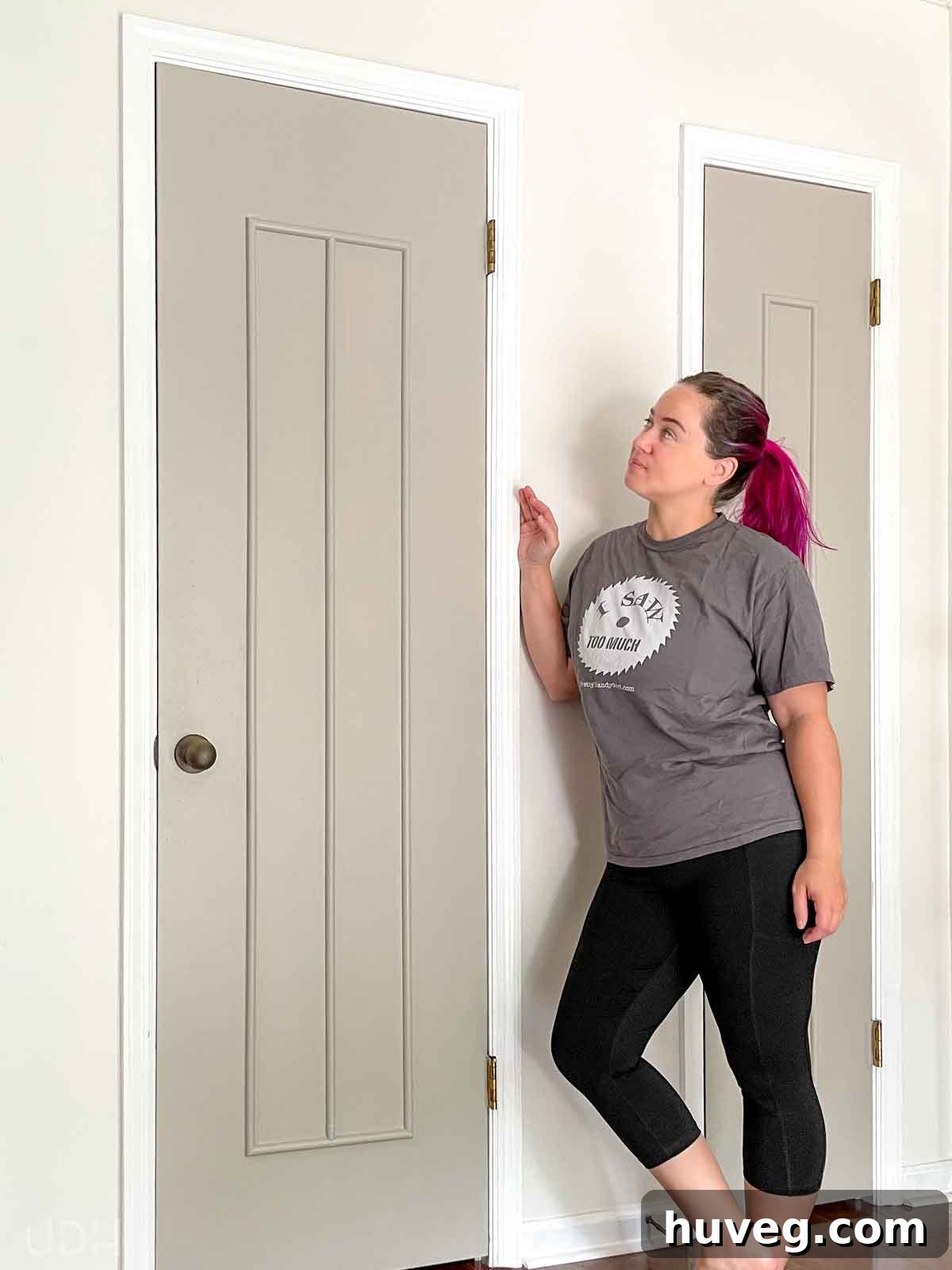 Transforming flat paneled doors with custom DIY door trim, adding architectural detail and elegance.