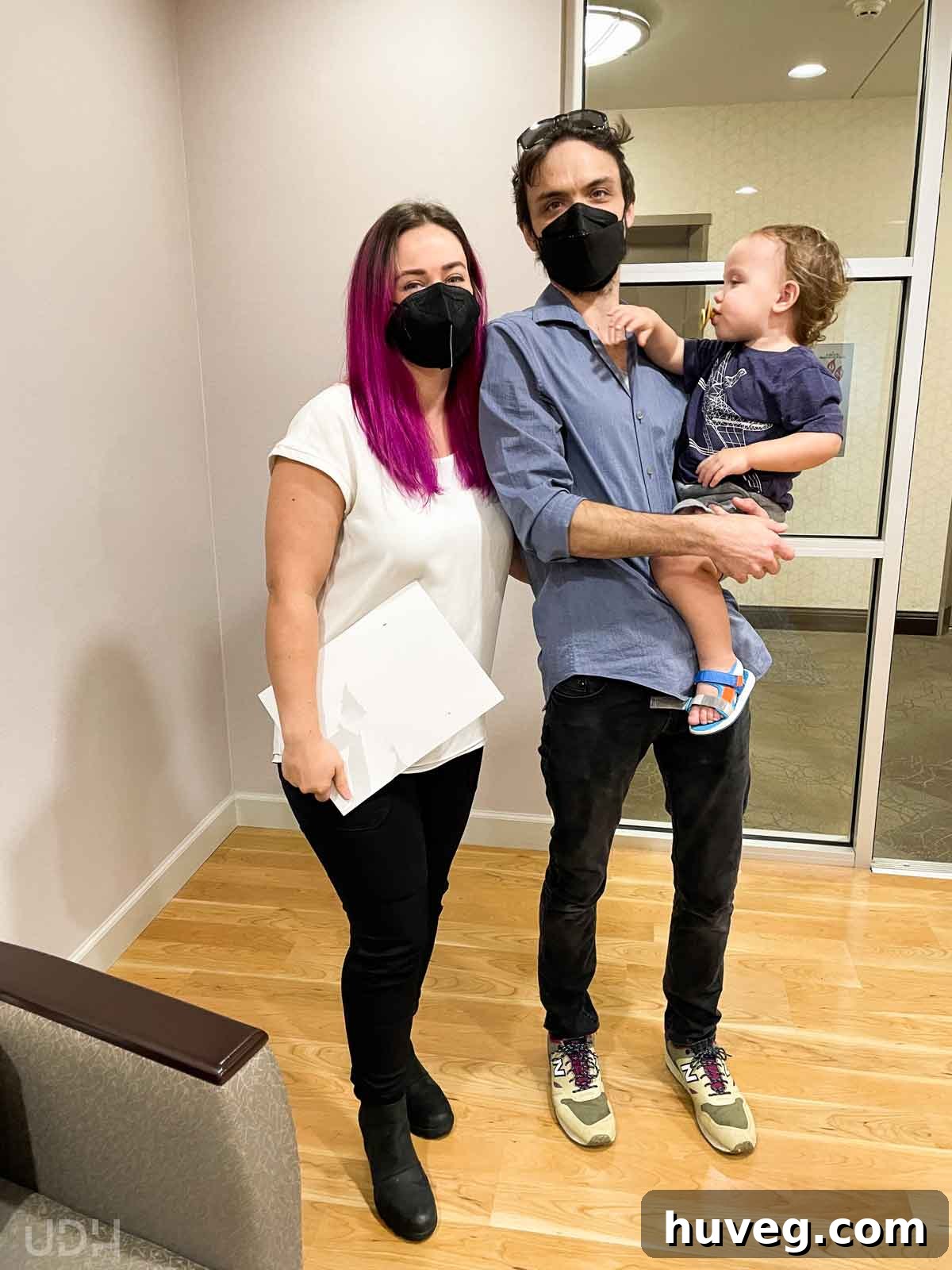 Our family of three celebrating at the closing office after successfully selling our home.