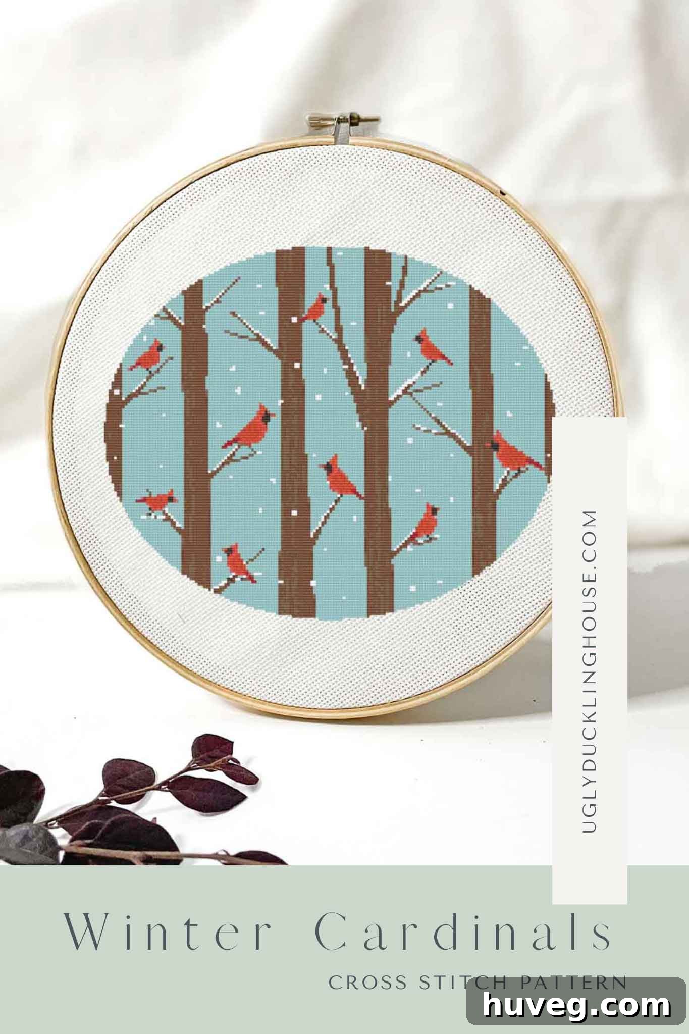 Stunning Winter Cardinals Cross Stitch Pattern featuring snowy trees and red birds, perfect for January crafting.