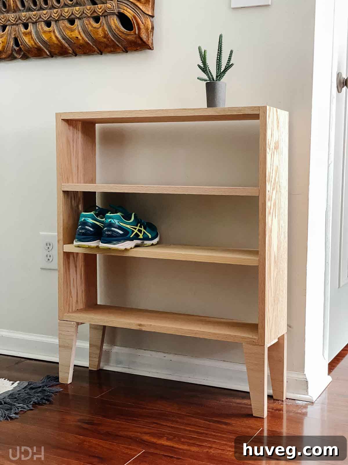 A simple yet elegant DIY shelf with legs, highlighting its versatile design and construction.