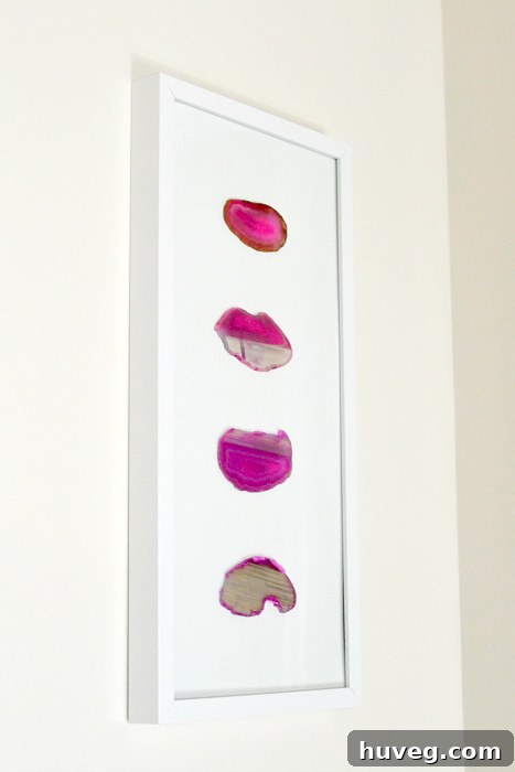 The unique texture and color of the pink agate slices create a captivating display.
