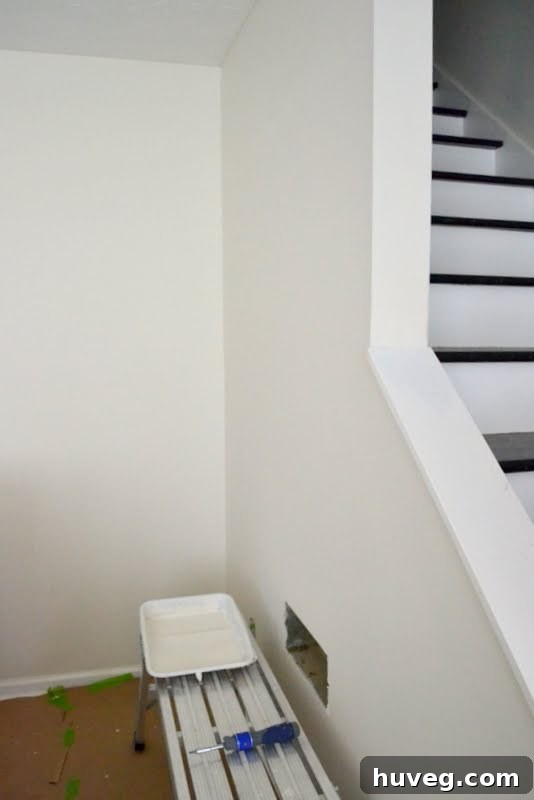 Freshly painted wall in a bright, neutral shade, reflecting natural light