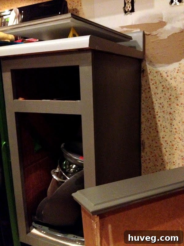Close-up of freshly painted kitchen cabinet door showing smooth finish with Benjamin Moore Advance