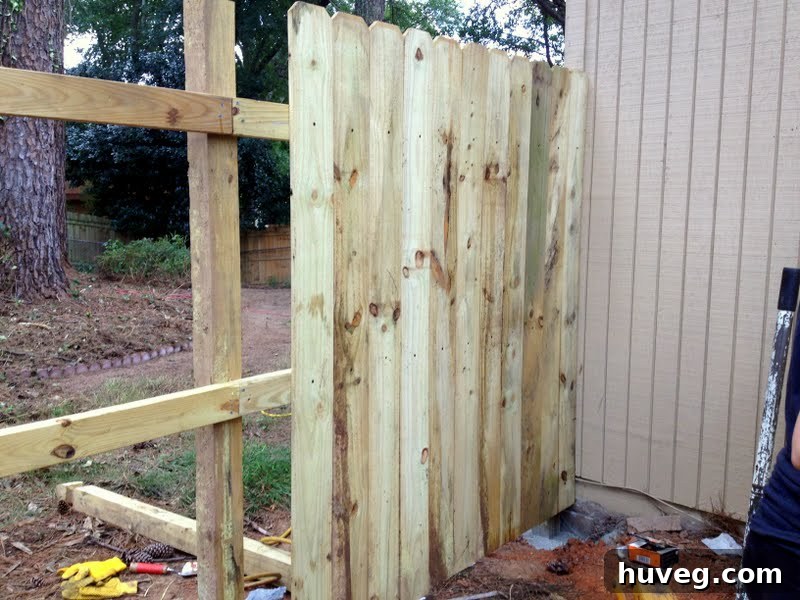 finished section of DIY wooden fence