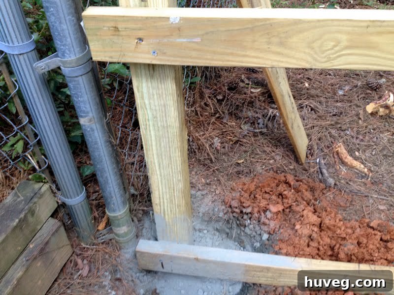 installing new wooden fence posts and stringers