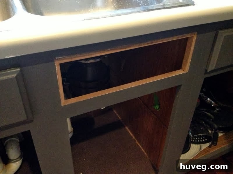 Another view of the false drawer front, showing the plastic turn clip moved to a central, functional position.