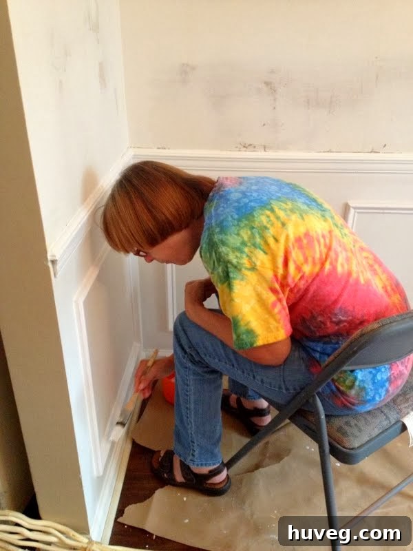 Painting new picture molding for the dining room during kitchen renovation