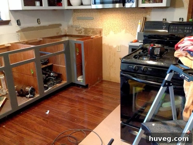 Old kitchen countertops removed, revealing the underlying cabinet structure