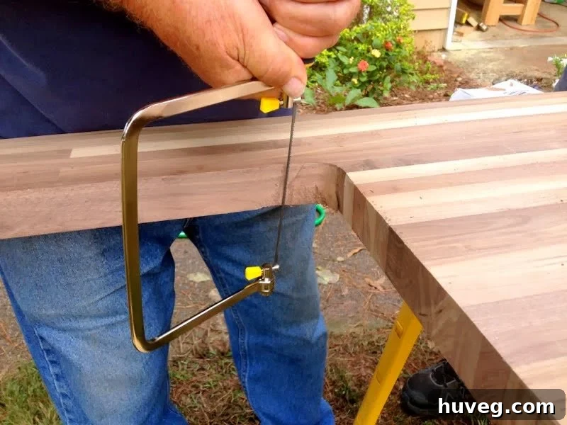 Cutting sink hole in butcher block with coping saw