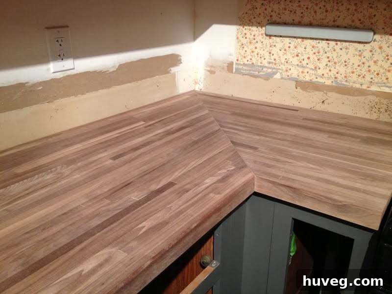 Untreated, light-colored walnut butcher block before any oil or wax application.