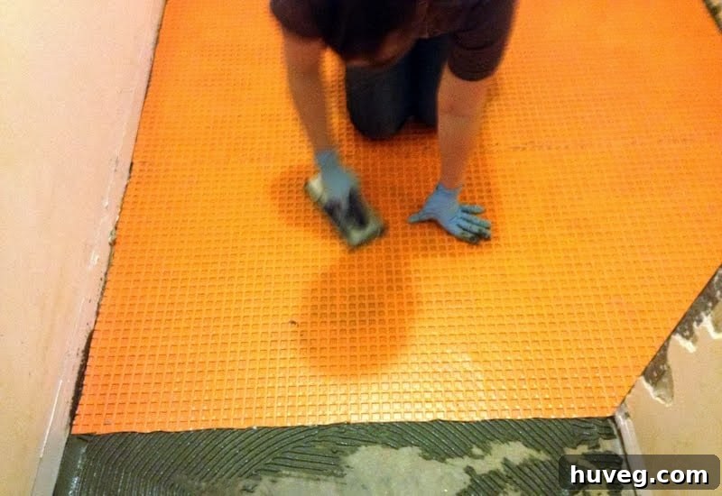 Tiling over a concrete subfloor with Ditra uncoupling membrane