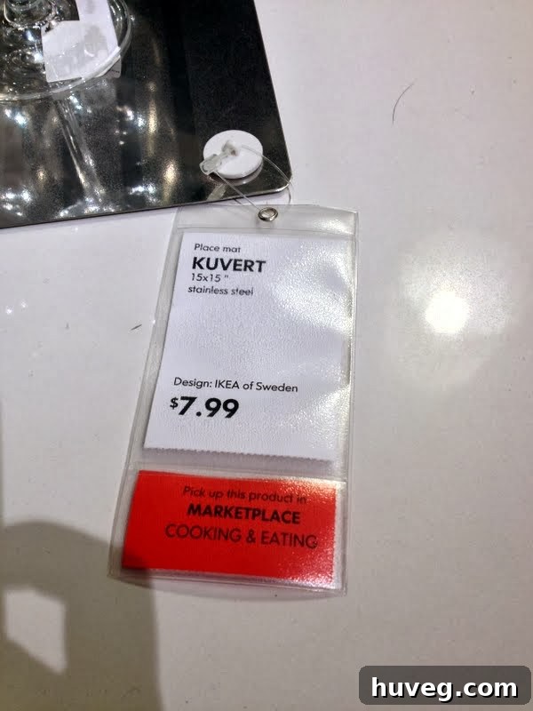 Woman taking a photo of an IKEA display with her phone