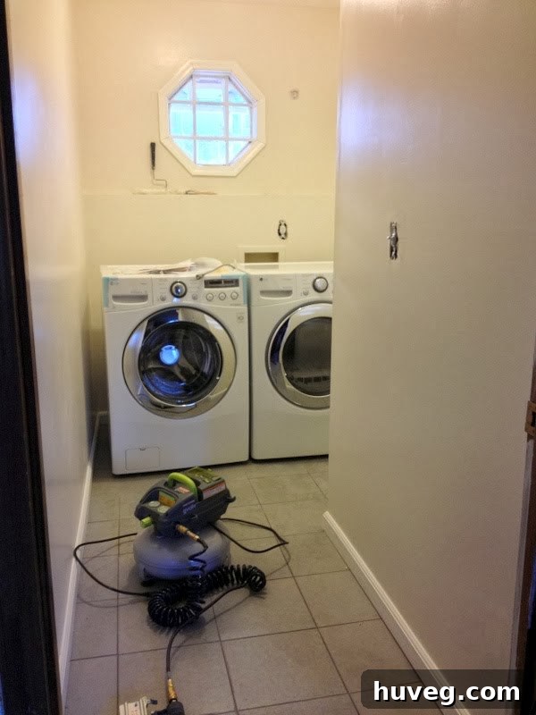 Newly installed LG front loader laundry set in a renovated room